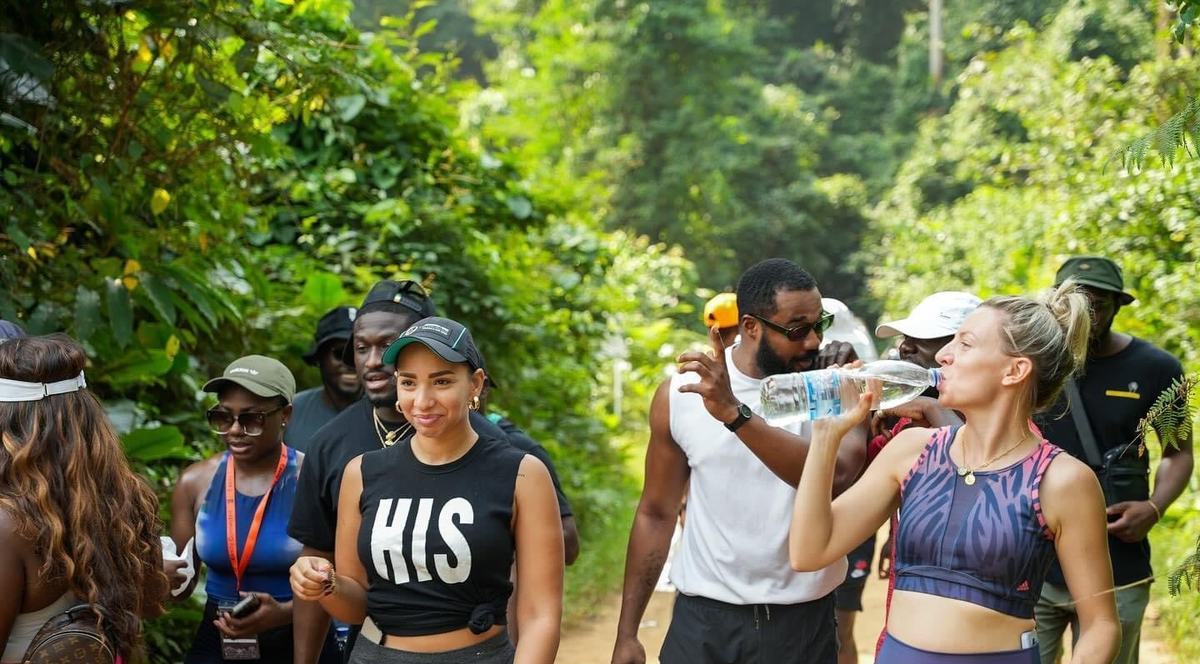 A group of participants hiking on a trail in the Banco forest